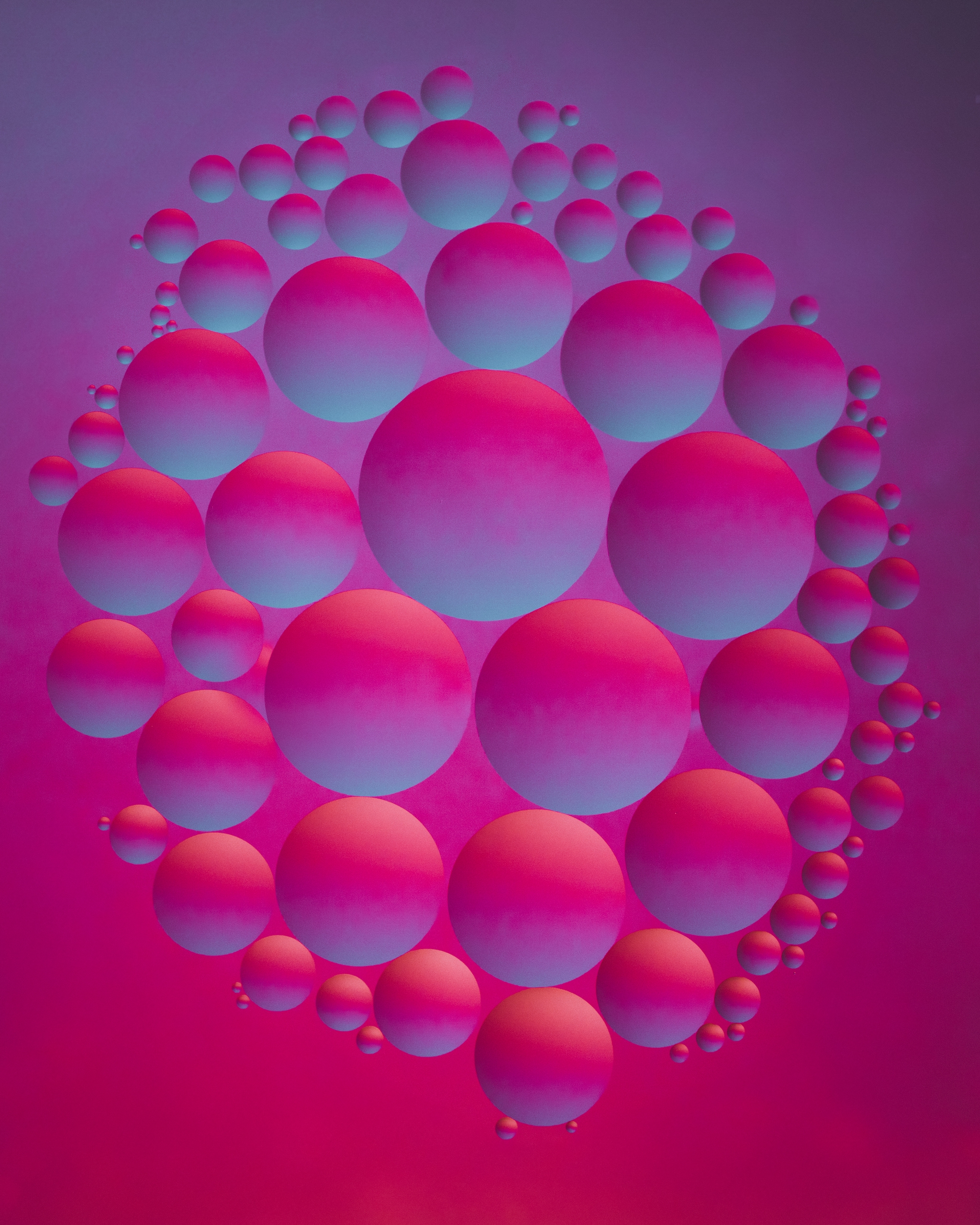 Multiple oil spheres in a gradient of blue and pink hues, arranged in a 3D cluster against a vibrant magenta and purple background